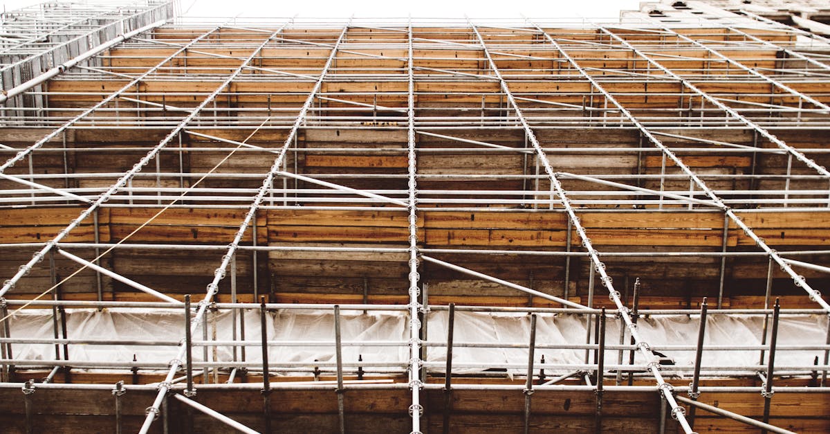 Services A detailed view of scaffolding at a construction site shows structure and pattern.